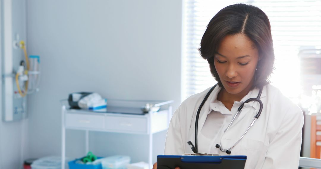 Female Doctor Writing Notes in Modern Medical Office - Free Images, Stock Photos and Pictures on Pikwizard.com