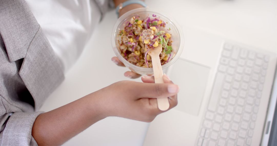 Close-up of Businessperson Eating Healthy Salad at Desk - Free Images, Stock Photos and Pictures on Pikwizard.com