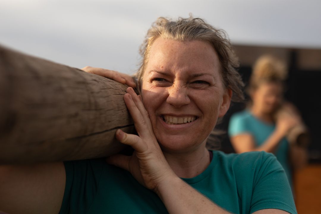 Caucasian Woman Carrying Log During Outdoor Boot Camp Training - Free Images, Stock Photos and Pictures on Pikwizard.com