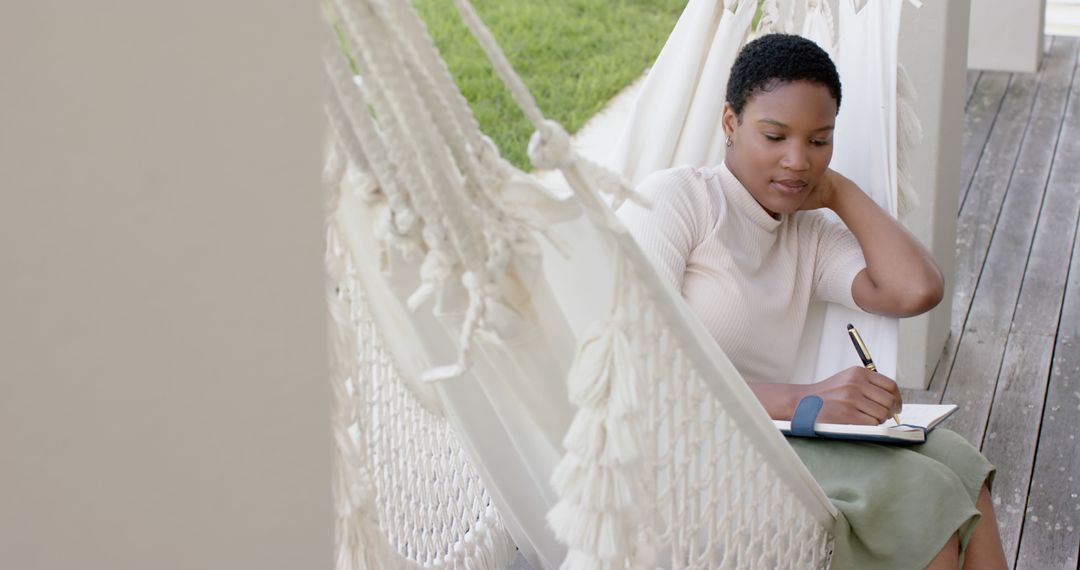 Young Woman Journaling Outdoors in a Hammock - Free Images, Stock Photos and Pictures on Pikwizard.com