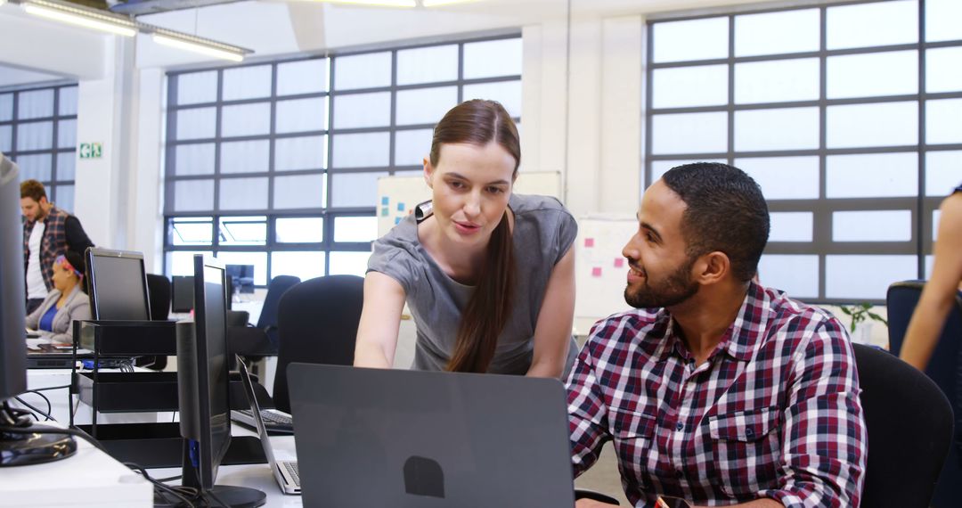 Diverse Teams Collaborating in a Modern Open Office