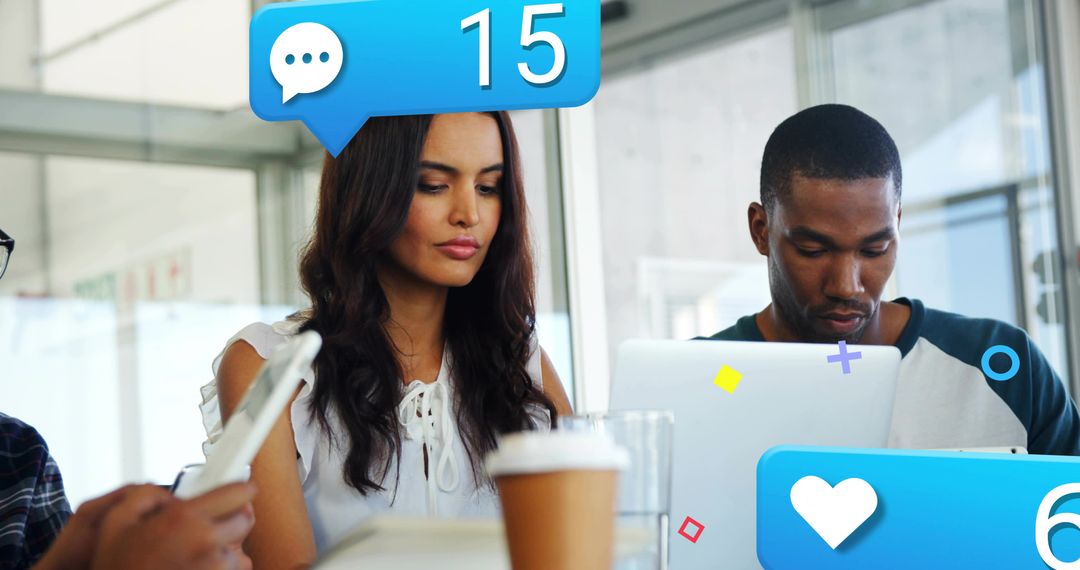 Young Professionals Using Technology in Collaborative Office Setting