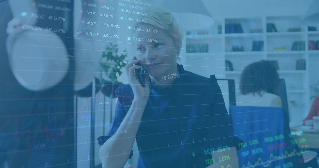 Businesswoman Analyzing Financial Data While on Phone