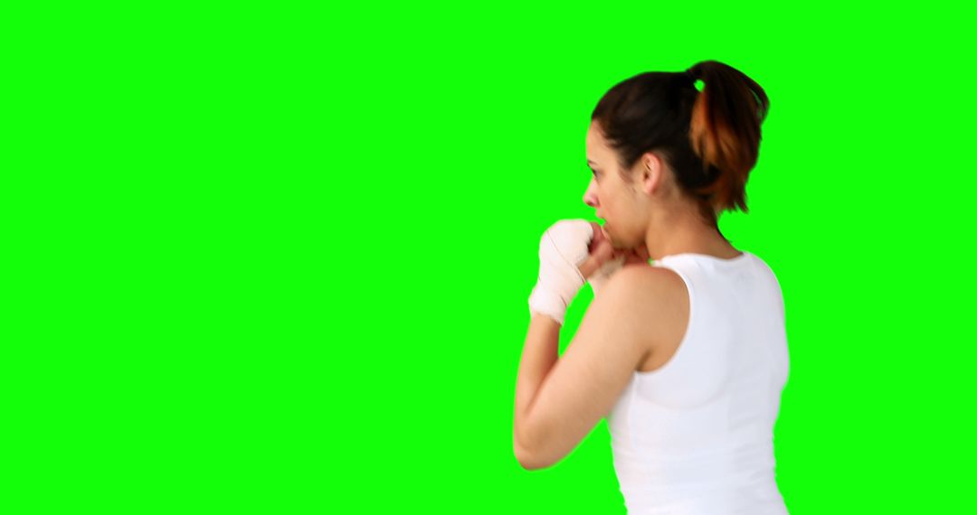 Woman Preparing for Boxing Workout on Green Screen - Free Images, Stock Photos and Pictures on Pikwizard.com