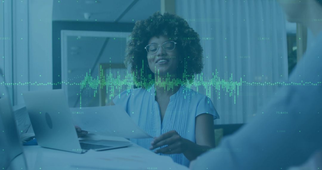 Businesswoman Analyzing Documents with Digital Analytics Overlay