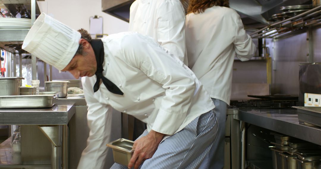 Chefs Collaborating in Busy Restaurant Kitchen