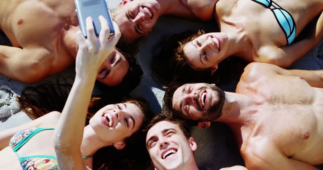 Young Friends Enjoying Beach Day Selfie Under the Sun