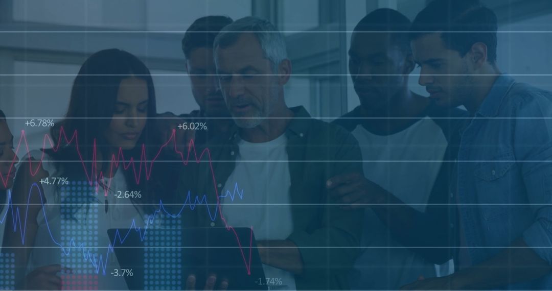 Diverse Team Analyzing Economic Data Overlaying Modern Workspace