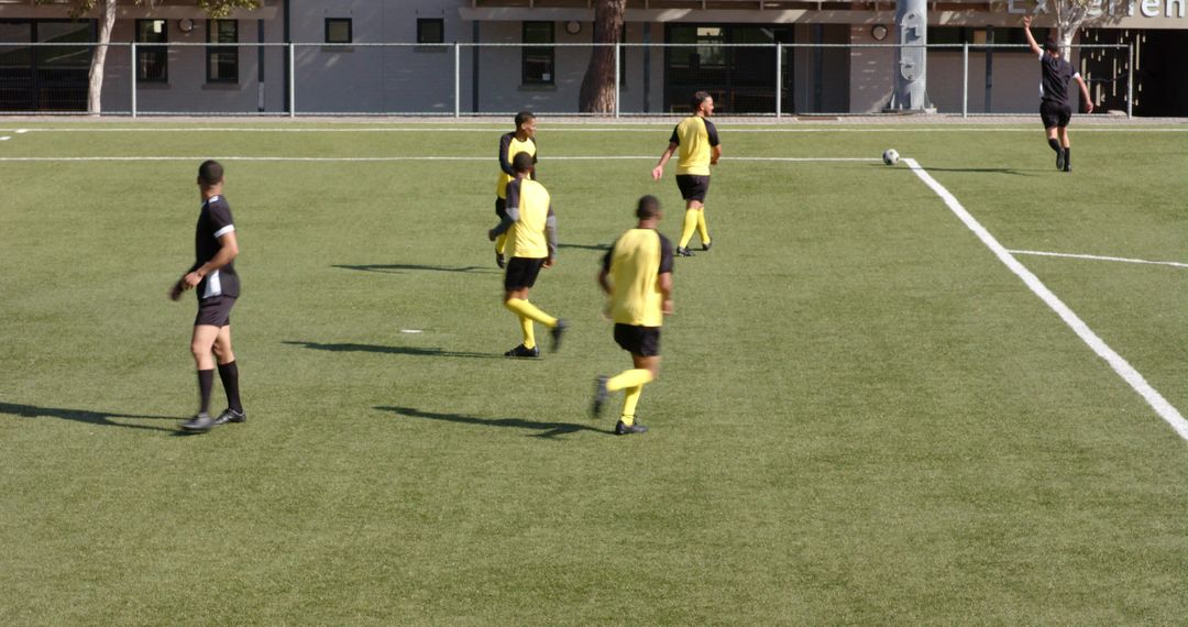Soccer Team Practicing with Coaches on Sunny Field