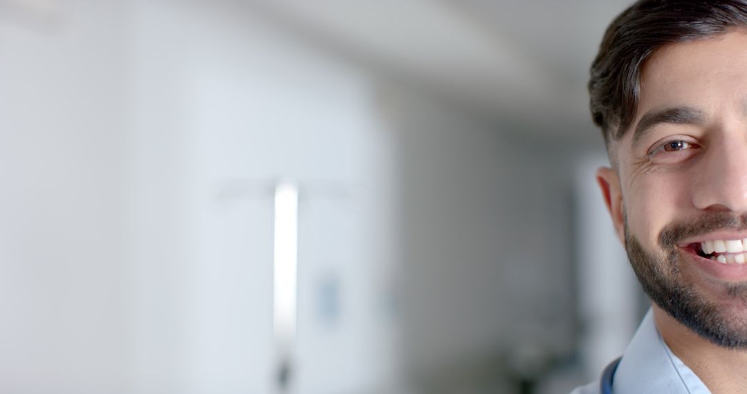Smiling Young Doctor in Hospital Corridor with Copy Space