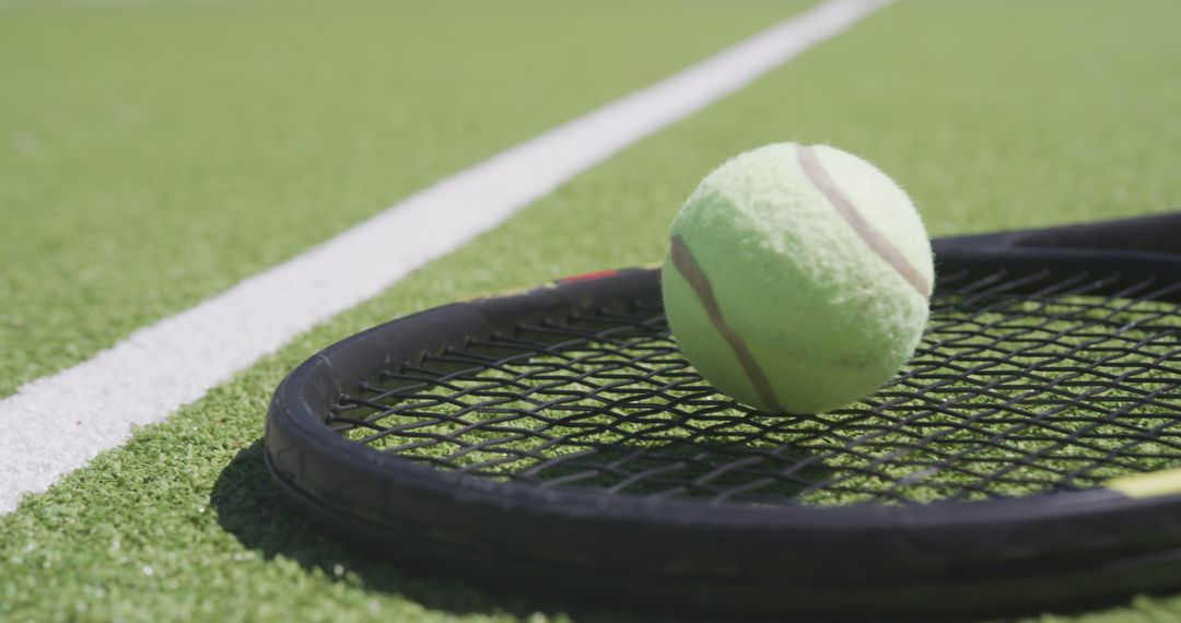 Close-up of Tennis Ball on Racket on Grass Court - Free Images, Stock Photos and Pictures on Pikwizard.com