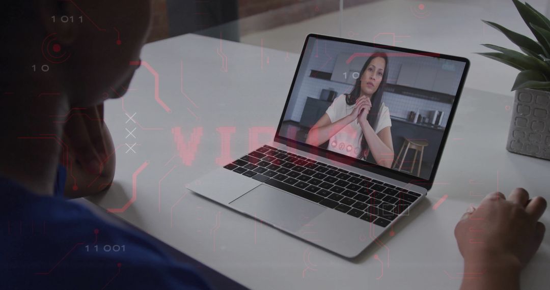 Person Participating in Remote Meeting on Laptop at Modern Workspace