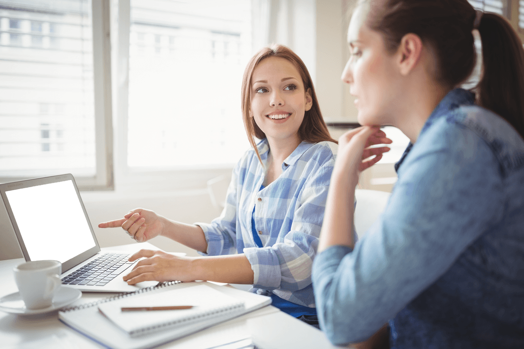 Transparent Laptop Usage by Female Colleagues in Office Setting
