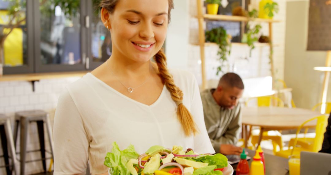 Smiling Woman Preparing Healthy Fresh Salad in Bright Kitchen - Free Images, Stock Photos and Pictures on Pikwizard.com