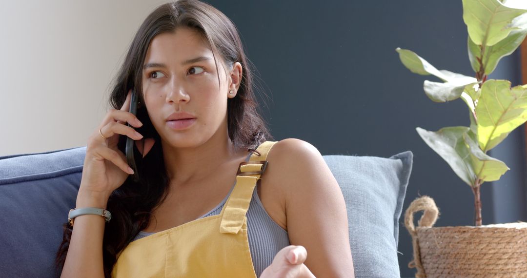 Teen Girl Seriously Discussing on Smartphone at Home