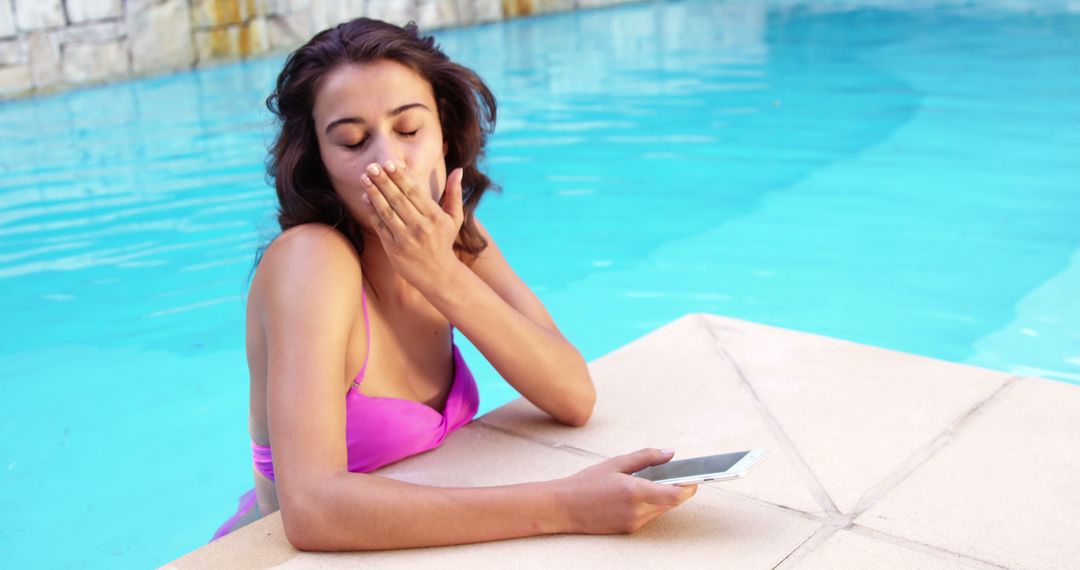 Woman in Pink Bikini Texting and Blowing a Kiss by Swimming Pool - Free Images, Stock Photos and Pictures on Pikwizard.com