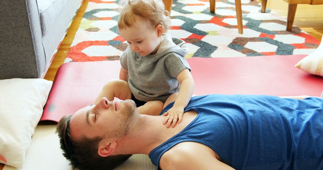 Father and Child Bonding on Living Room Floor with Colorful Rug - Free Images, Stock Photos and Pictures on Pikwizard.com