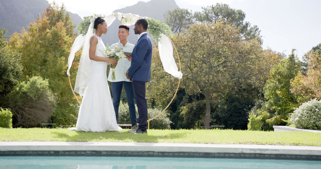 Outdoor Multiracial Wedding Ceremony near Pool with Mountains Background - Free Images, Stock Photos and Pictures on Pikwizard.com