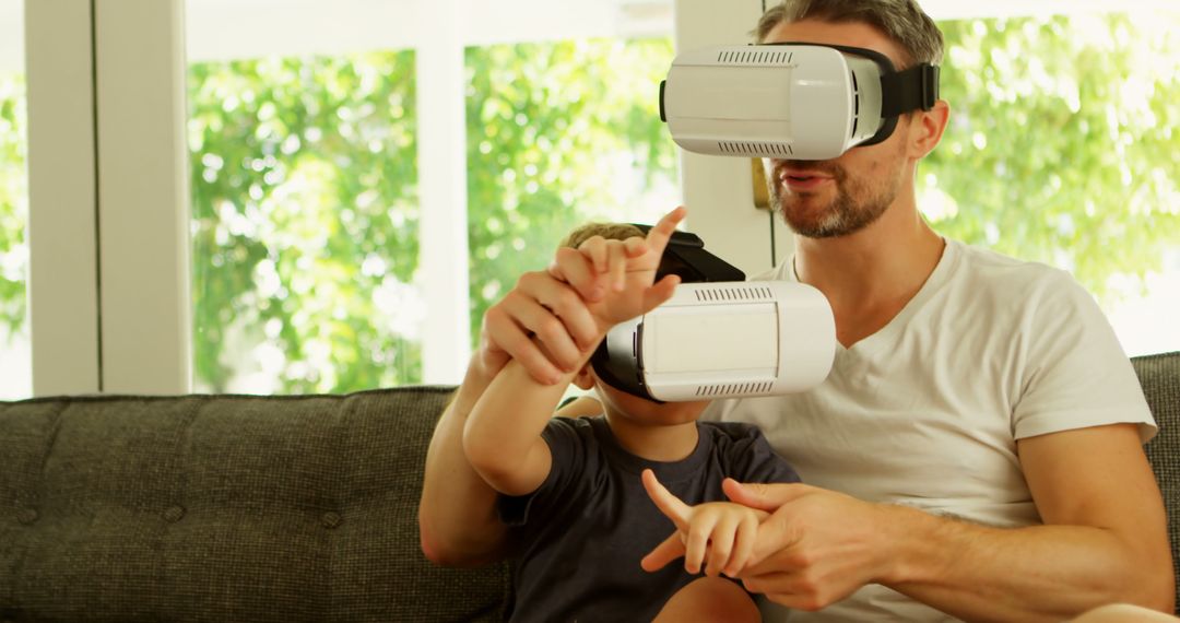 Father and Son Experiencing Virtual Reality with VR Headsets at Home - Free Images, Stock Photos and Pictures on Pikwizard.com