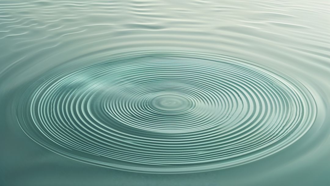 Concentric Ripples on Calm Water Surface Depicting Fluidity