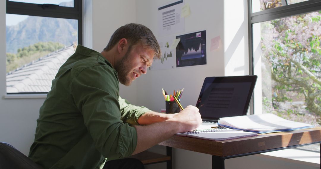 Man Working from Home at Desk - Free Images, Stock Photos and Pictures on Pikwizard.com