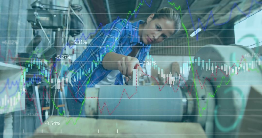 Engineer Aligning Wood Under Roller in Industrial Workshop