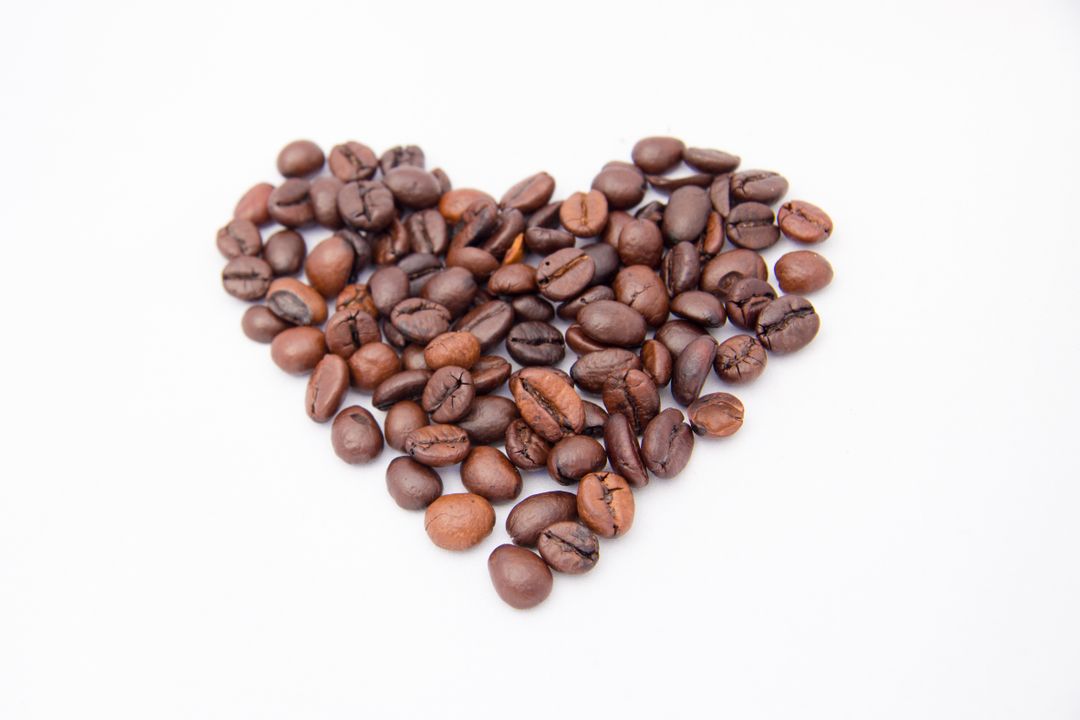 Close-up of Coffee Beans on White Background - Free Images, Stock Photos and Pictures on Pikwizard.com