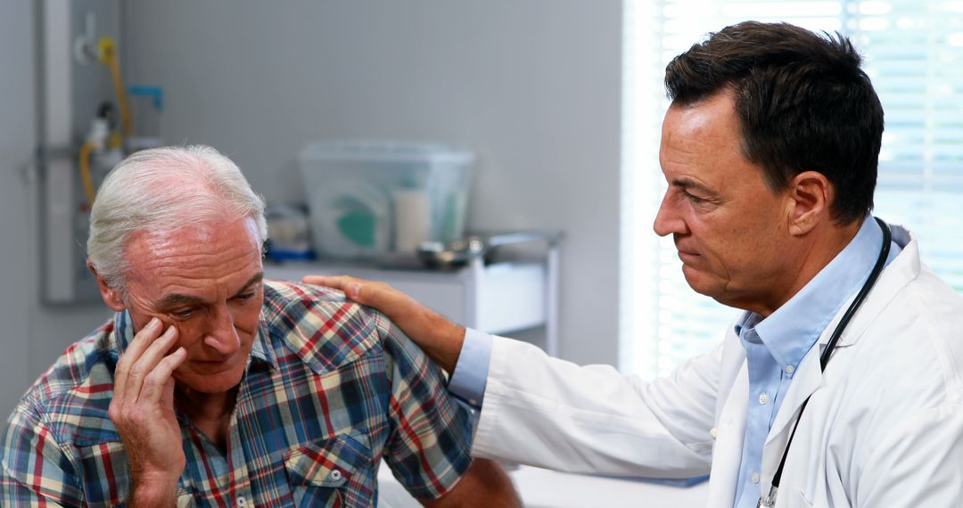 Doctor Consoling Upset Elderly Patient During Consultation - Free Images, Stock Photos and Pictures on Pikwizard.com