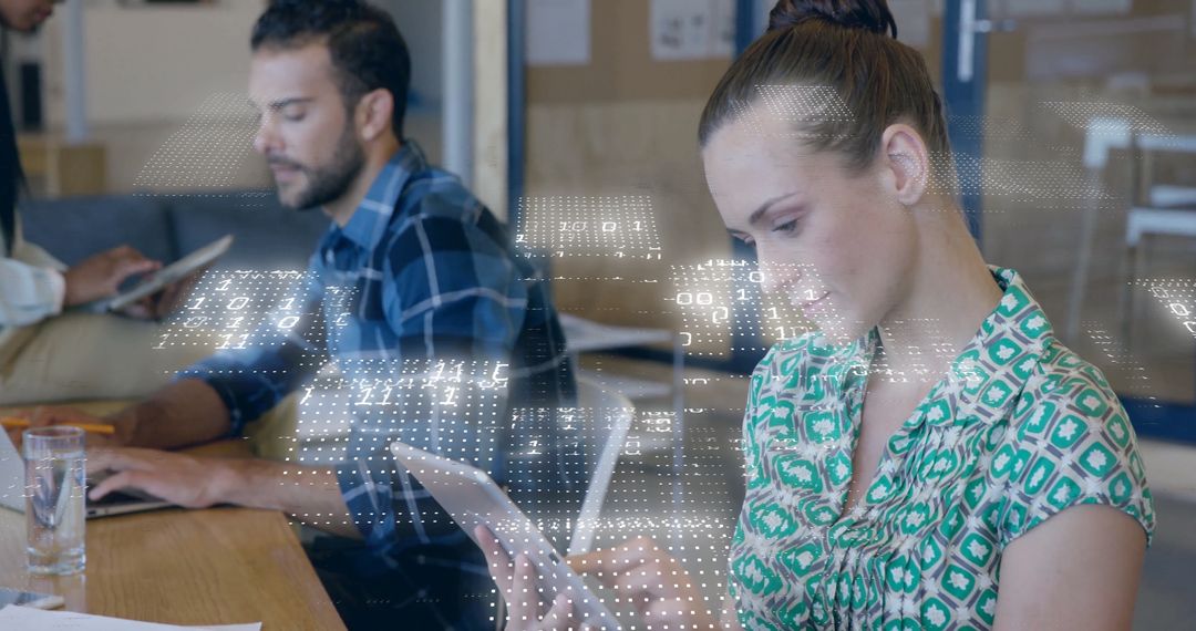 Binary Code Overlay on Business Professionals in Modern Office