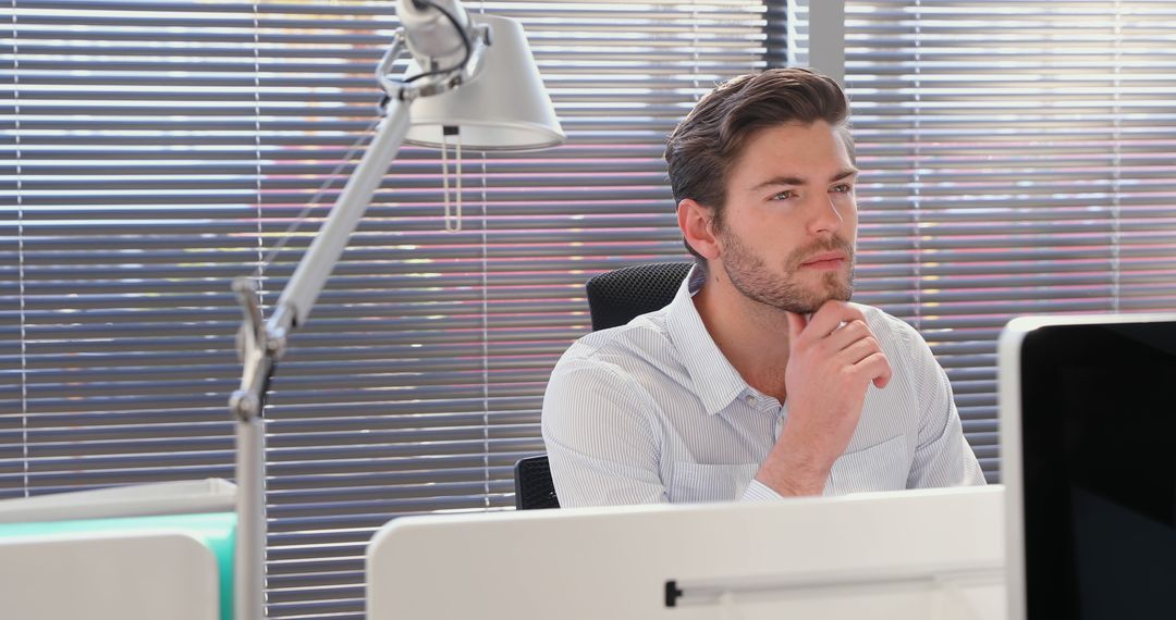 Pensive Businessman Contemplating Ideas at Office Desk - Free Images, Stock Photos and Pictures on Pikwizard.com