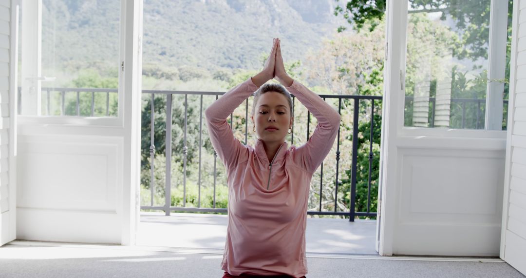 Woman Practicing Yoga in Tranquil Home Setting with Mountain View - Free Images, Stock Photos and Pictures on Pikwizard.com