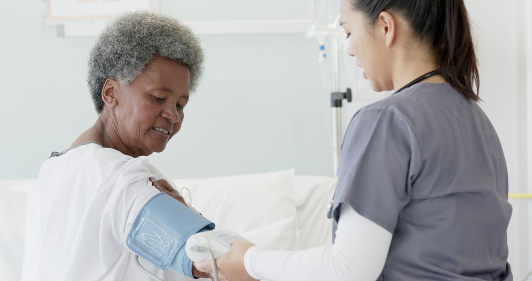 Nurse Measuring Blood Pressure of Senior Woman in Hospital - Free Images, Stock Photos and Pictures on Pikwizard.com