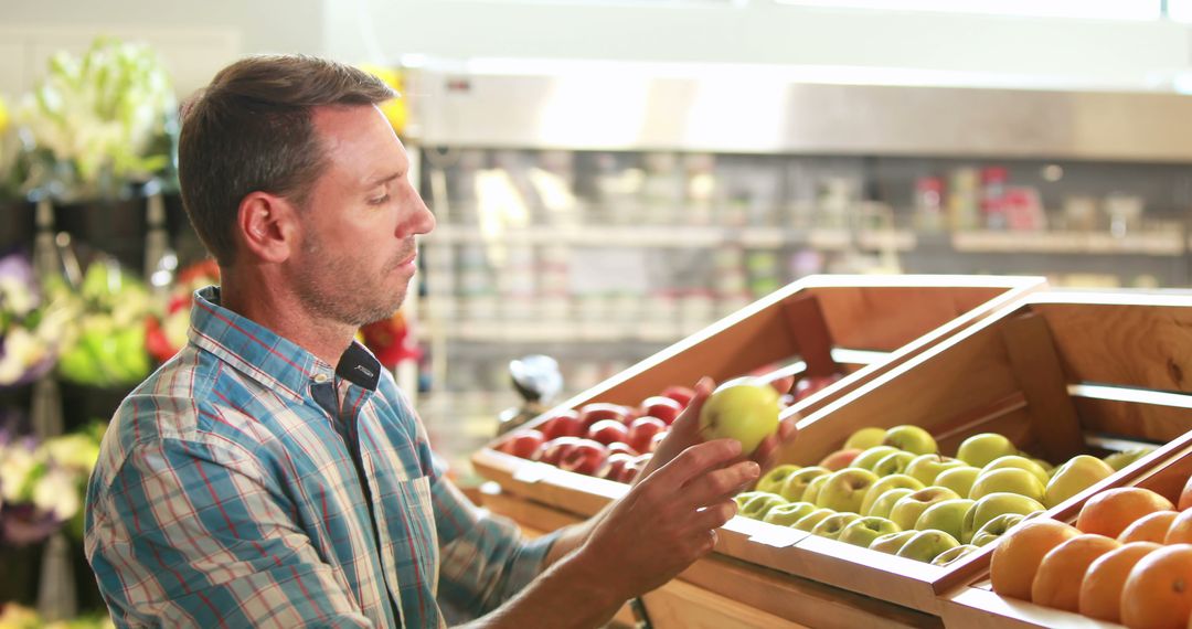 Man selecting fresh produce in grocery store - Free Images, Stock Photos and Pictures on Pikwizard.com