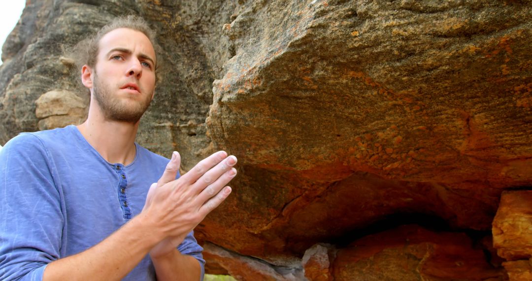 Man Preparing to Climb Rock Formation Outdoors - Free Images, Stock Photos and Pictures on Pikwizard.com