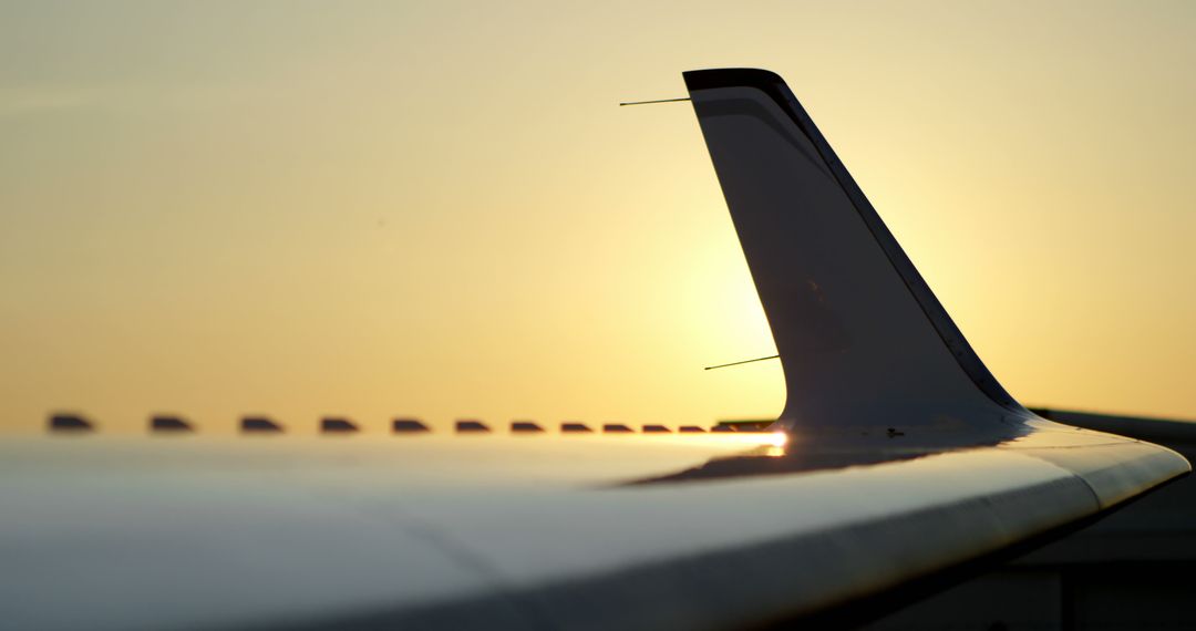 Airplane Wing Silhouette During Golden Hour Sunset - Free Images, Stock Photos and Pictures on Pikwizard.com