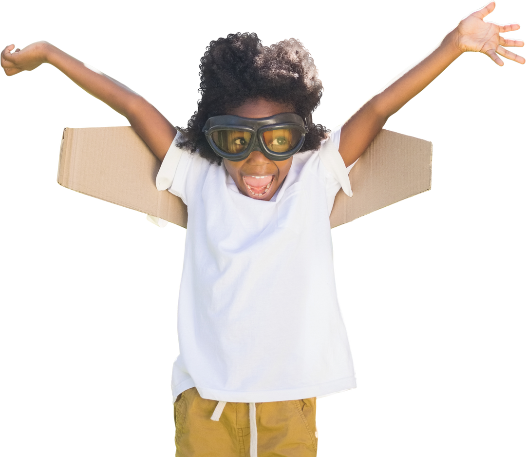 Playful Child Wearing Transparent Goggles Posing With Cardboard Wings - Download Free Stock Images Pikwizard.com