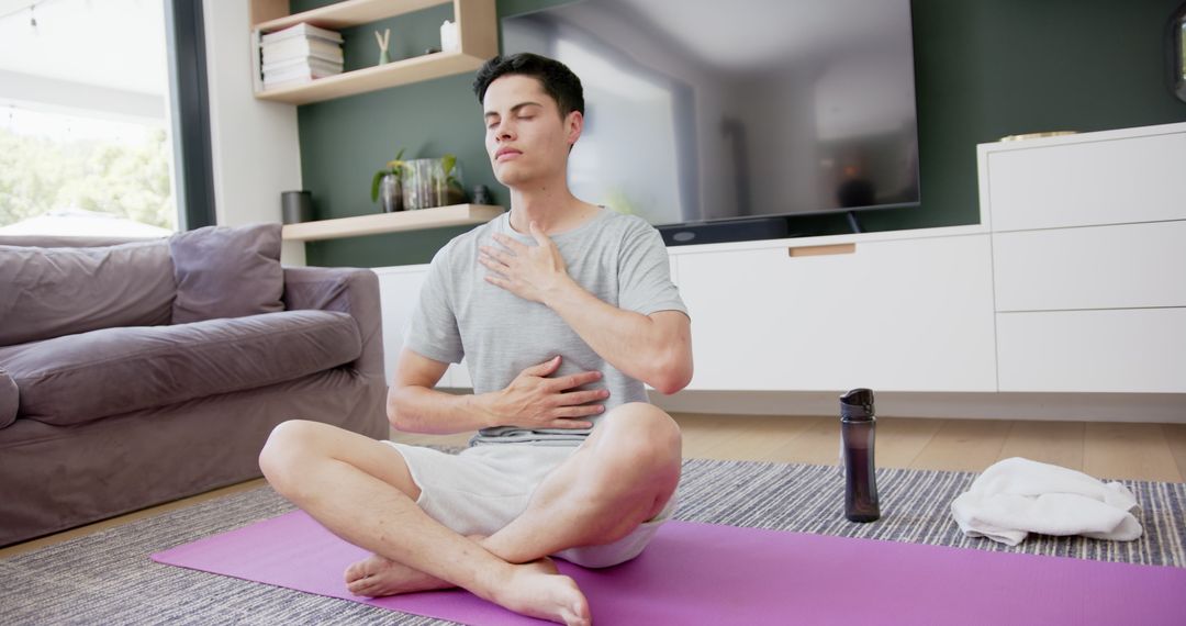 Man Practicing Mindful Yoga and Meditation at Home