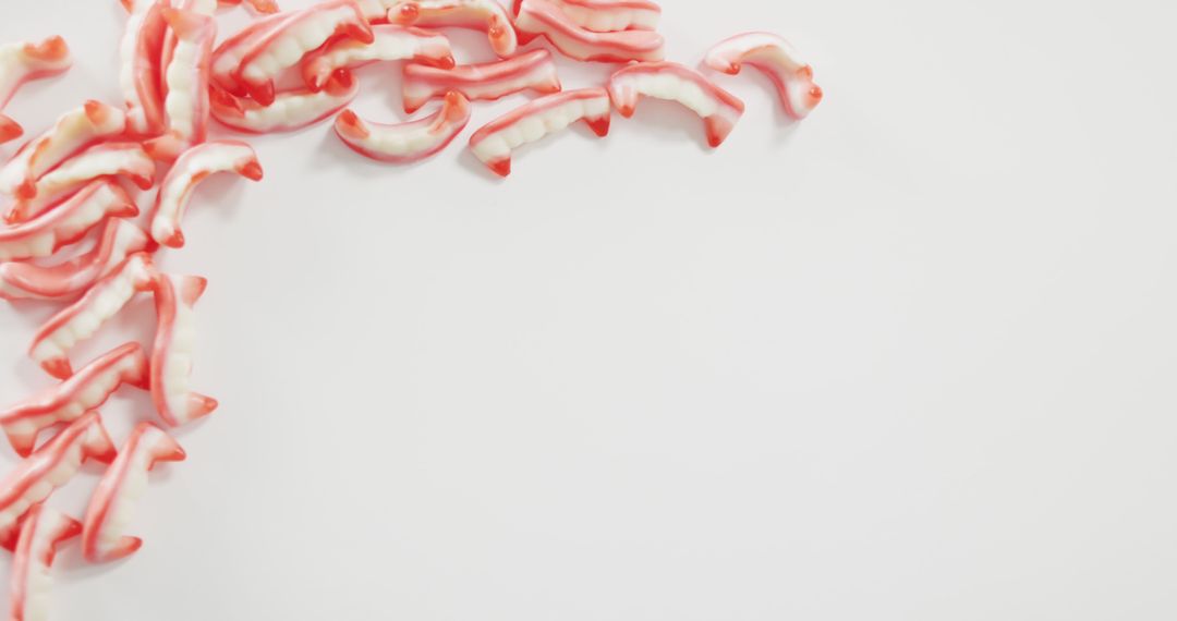 Pile of Candy Teeth with Empty Space on White Background - Free Images, Stock Photos and Pictures on Pikwizard.com