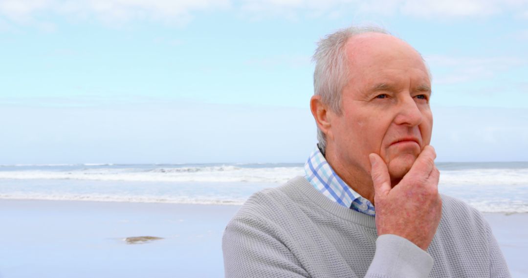 Mature Man Pondering Life by the Sea on a Clear Day - Free Images, Stock Photos and Pictures on Pikwizard.com