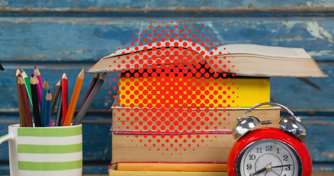School Supplies with Colorful Books and Alarm Clock