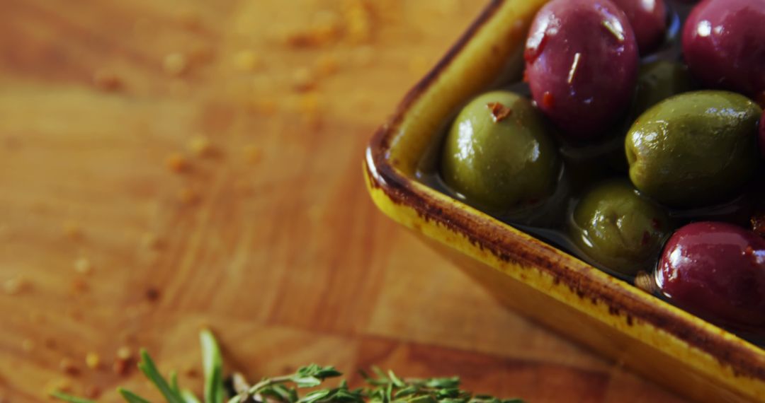 Close-Up of Assorted Olives in Ceramic Bowl on Wooden Surface - Free Images, Stock Photos and Pictures on Pikwizard.com