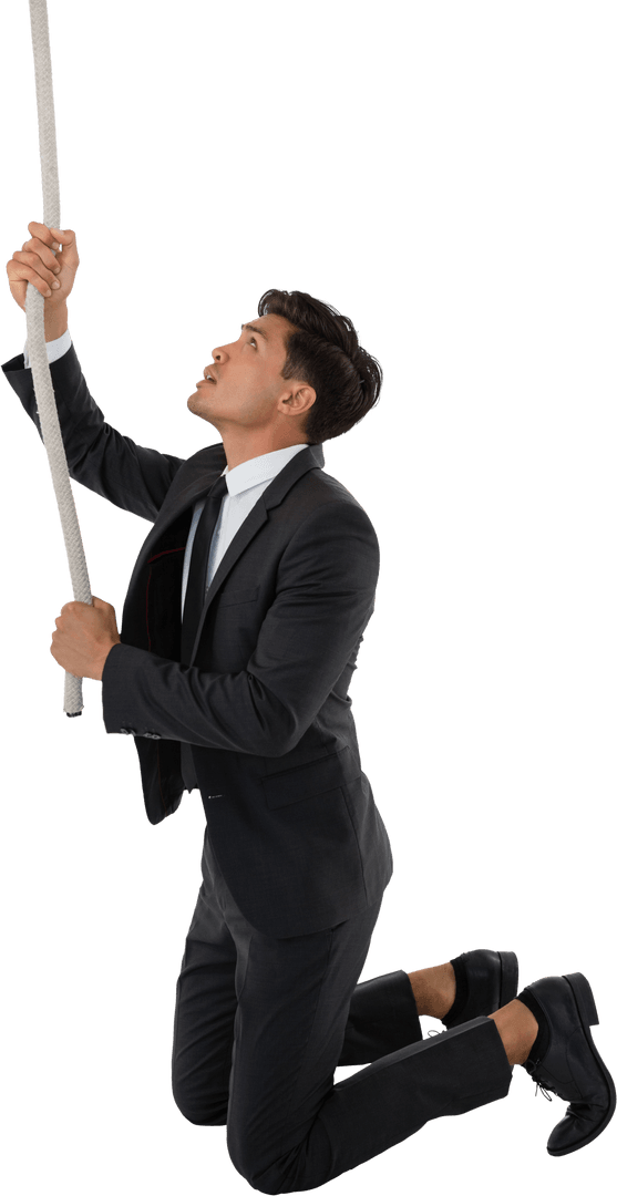Businessman Pulling Transparent Rope While Kneeling in Determination