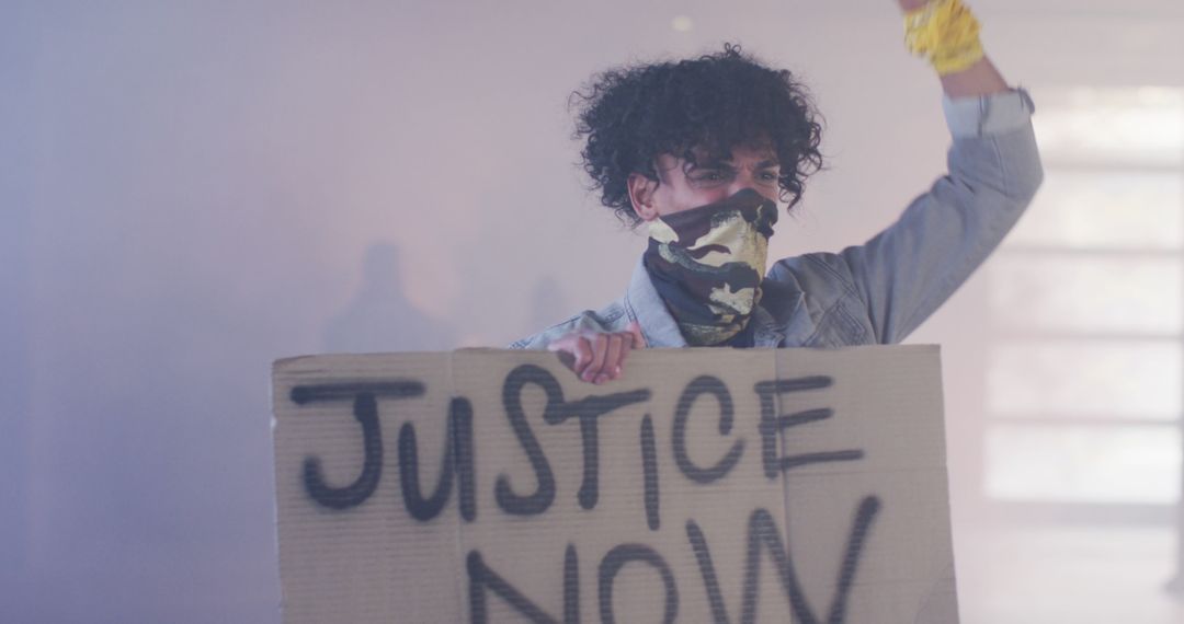 Protester Demanding Justice in Urban Setting with Mask and Sign - Free Images, Stock Photos and Pictures on Pikwizard.com