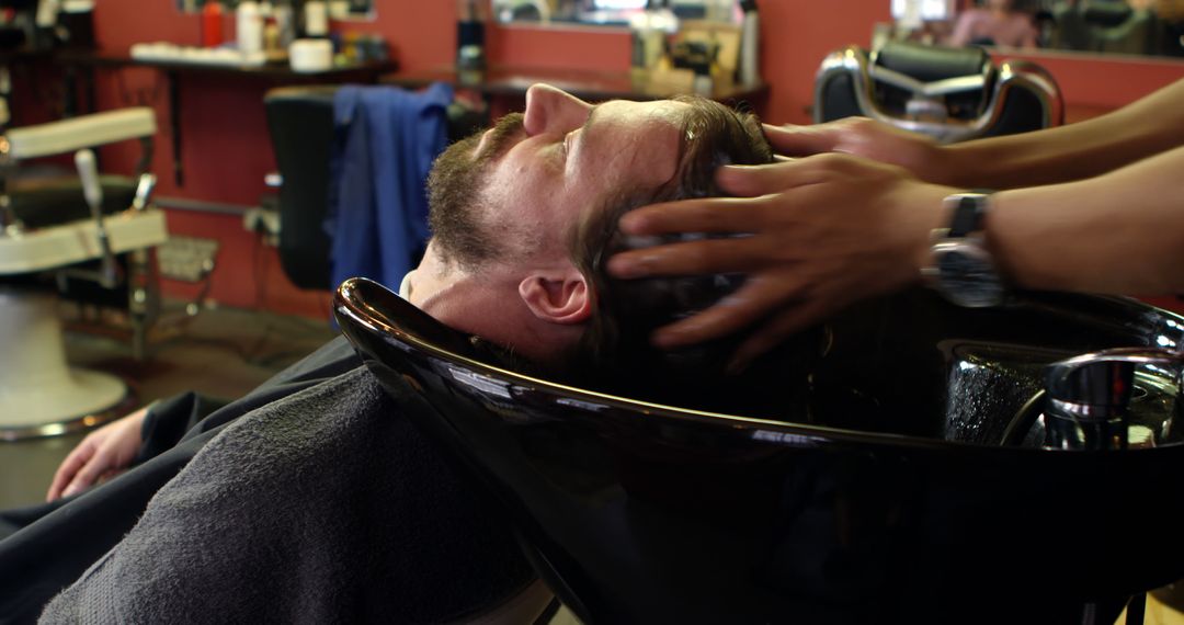 Man Getting Hair Washed in Barbershop - Free Images, Stock Photos and Pictures on Pikwizard.com