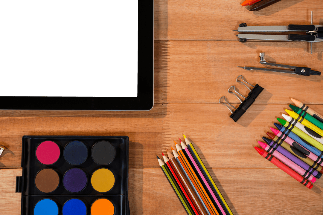 Transparent Filled Table with Tablet and Colorful Stationery Essentials