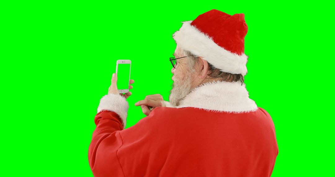 Santa Claus Using Smartphone with Green Screen Background - Free Images, Stock Photos and Pictures on Pikwizard.com