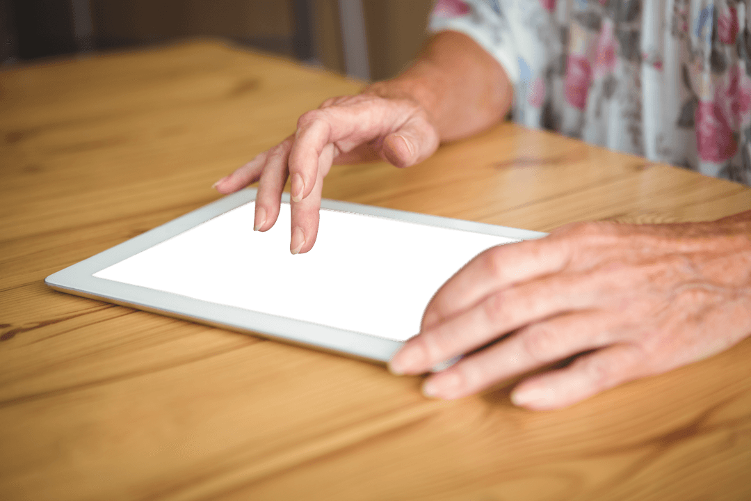 Senior Hands Touching Transparent Screen Tablet