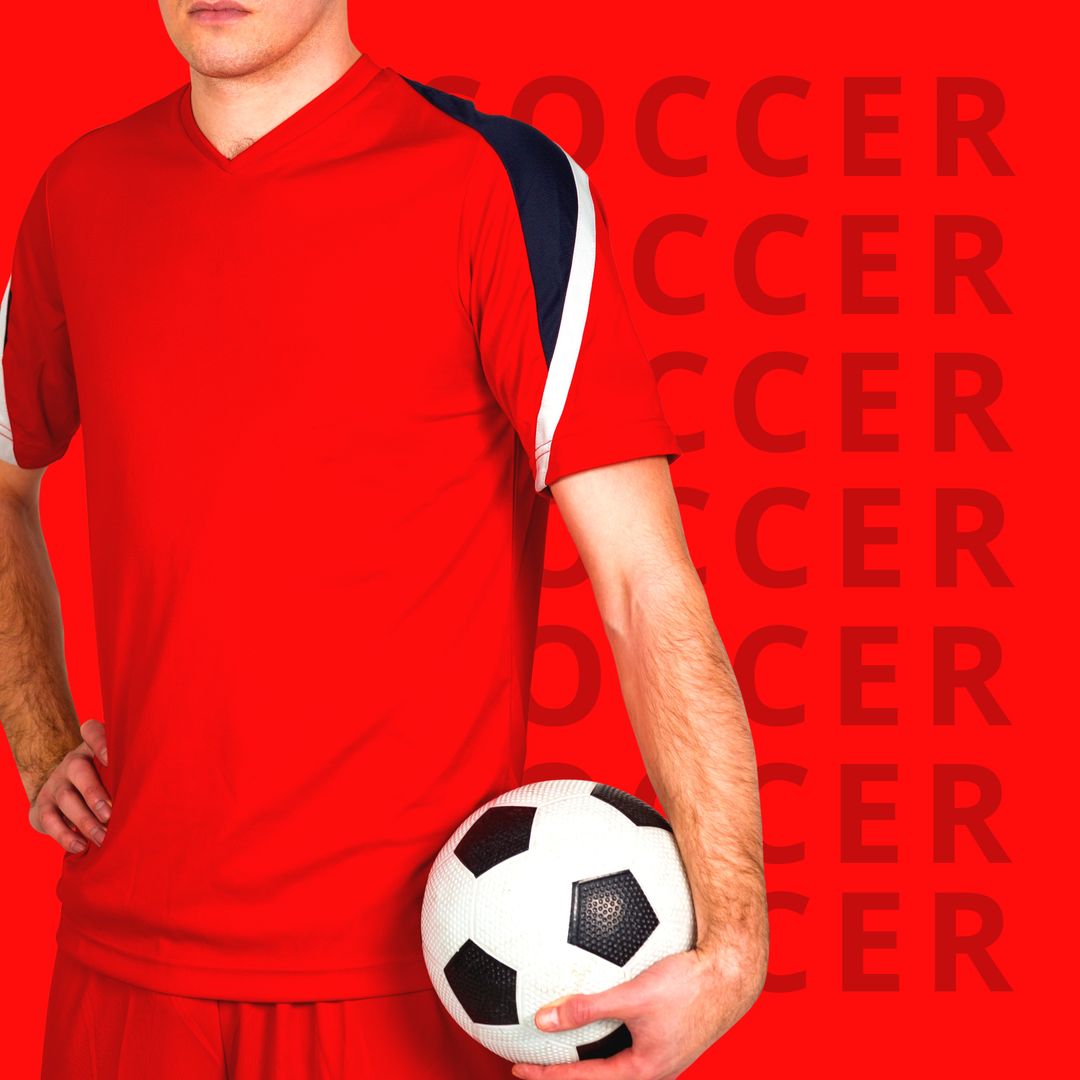 Soccer Player in Red Uniform Holding Soccer Ball