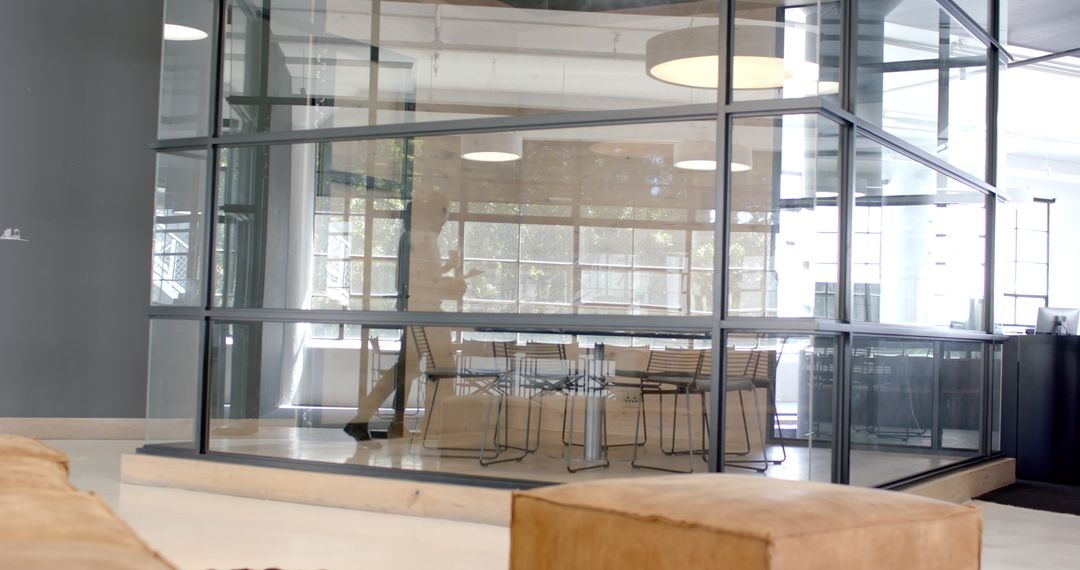 Businessman Strolling Through Bright Modern Office With Drafts