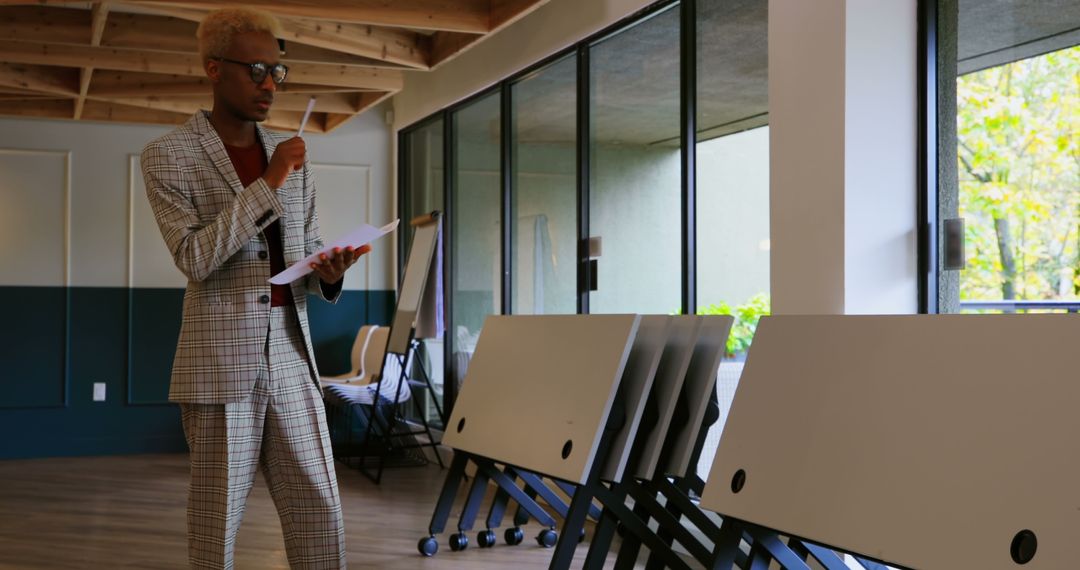 Confident Businessman Reviewing Documents in Office